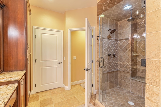 bathroom featuring vanity and an enclosed shower