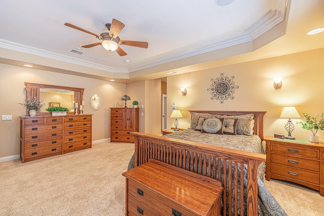 carpeted bedroom with ceiling fan, a raised ceiling, and crown molding