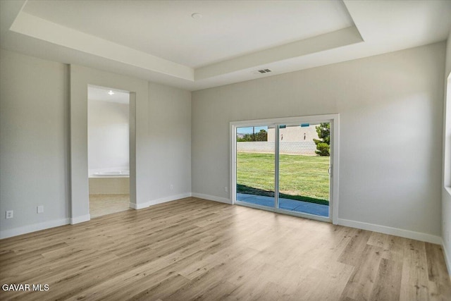 41729 Firenze St, Lancaster, CA 93536 - empty room featuring wood finished floors and a tray ceiling