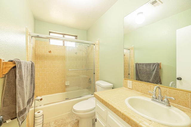full bathroom with vanity, toilet, shower / bath combination with glass door, and visible vents