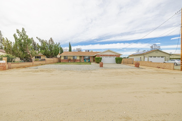ranch-style house with fence