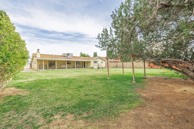 view of yard with fence and a patio area