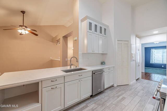 4068 Vancouver Ln, Quartz Hill, CA 93536 - kitchen featuring dishwasher, a ceiling fan, white cabinets, high vaulted ceiling, and light wood-style flooring
