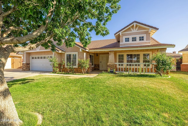 4068 Vancouver Ln, Quartz Hill, CA 93536 - view of front facade with stucco siding, driveway, a garage, and stone siding