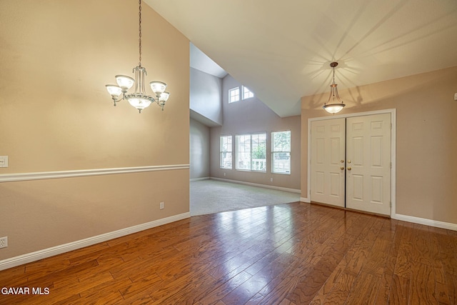 4068 Vancouver Ln, Quartz Hill, CA 93536 - foyer entrance with a chandelier, wood finished floors, and high vaulted ceiling