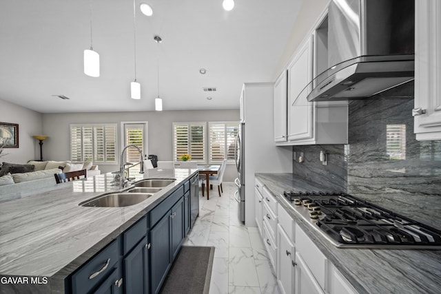 42409 W 66th St, Lancaster, CA 93536 - kitchen featuring wall chimney exhaust hood, stainless steel appliances, blue cabinets, light marble finish floors, and white cabinets