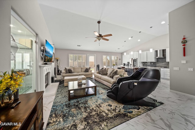 42409 W 66th St, Lancaster, CA 93536 - living area with light marble finish floors, ceiling fan, a fireplace with raised hearth, lofted ceiling, and recessed lighting