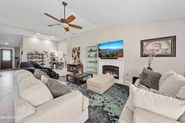 42409 W 66th St, Lancaster, CA 93536 - living room with a ceiling fan, a glass covered fireplace, vaulted ceiling, and recessed lighting