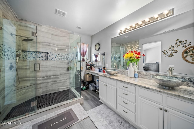 42409 W 66th St, Lancaster, CA 93536 - full bath with double vanity, a stall shower, and wood finished floors