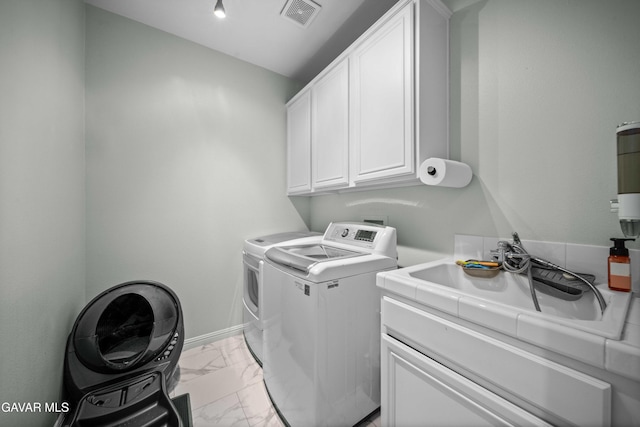 42409 W 66th St, Lancaster, CA 93536 - laundry room featuring light marble finish flooring, independent washer and dryer, and cabinet space