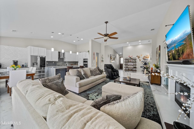 42409 W 66th St, Lancaster, CA 93536 - living area featuring light marble finish flooring, high vaulted ceiling, ceiling fan, and recessed lighting