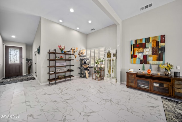 42409 W 66th St, Lancaster, CA 93536 - foyer entrance featuring healthy amount of natural light, a high ceiling, recessed lighting, and marble look tiles