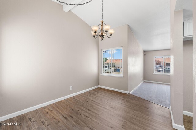 4633 Dowel Ave, Palmdale, CA 93552 - empty room featuring a chandelier, wood finished floors, and lofted ceiling