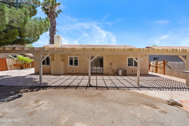 4633 Dowel Ave, Palmdale, CA 93552 - rear view of house featuring a chimney, a patio, a pergola, and stucco siding