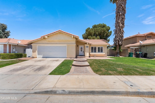 4633 Dowel Ave, Palmdale, CA 93552 - view of front of house with a tiled roof, stucco siding, a garage, and driveway
