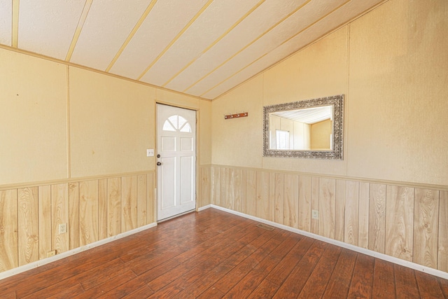 entryway featuring wood-type flooring and lofted ceiling