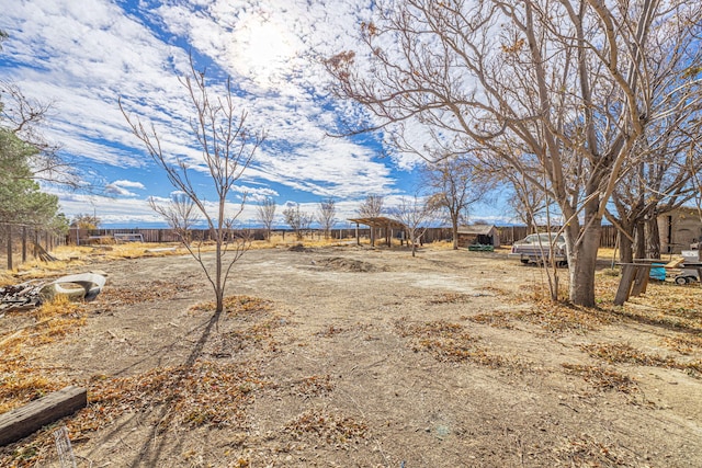 view of yard with a rural view