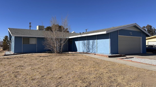 single story home featuring a garage