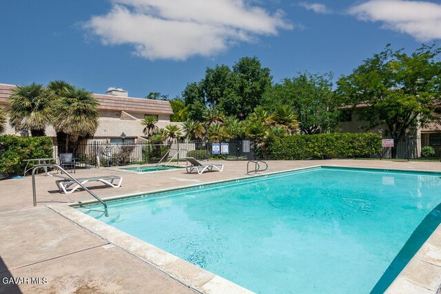 425 W W Ave J5, Unit 37, Lancaster, CA 93534 - community pool featuring a patio and a hot tub