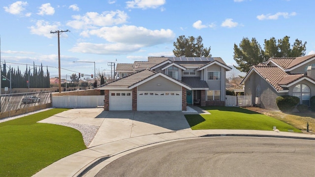 view of property featuring a front lawn and solar panels