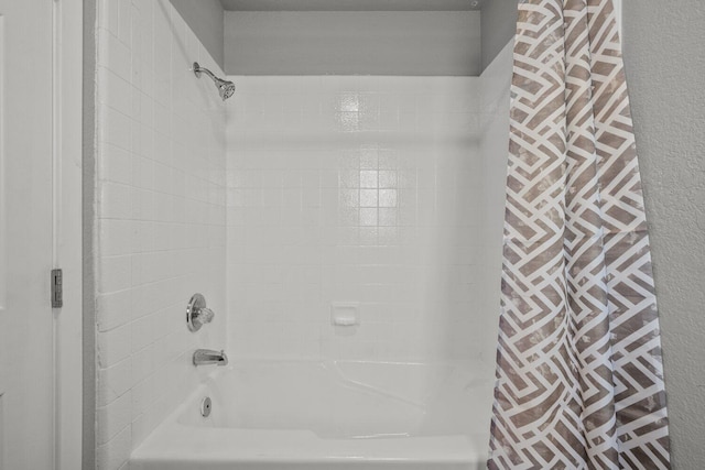 bathroom with shower / bath combo