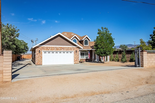 33430 E 133rd St, Pearblossom, CA 93553 - view of front of home featuring stone siding, an attached garage, and driveway