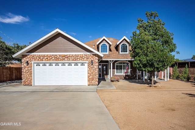 33430 E 133rd St, Pearblossom, CA 93553 - view of front of property with concrete driveway, stone siding, and an attached garage