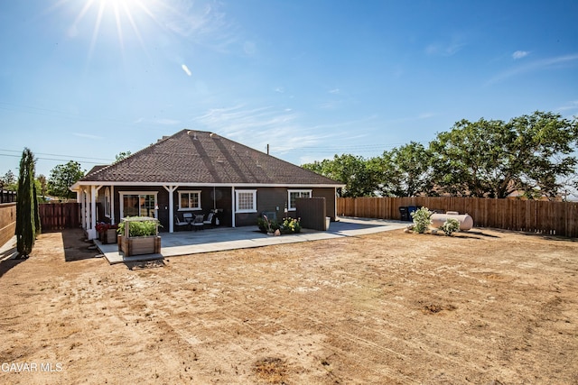 33430 E 133rd St, Pearblossom, CA 93553 - rear view of house with a fenced backyard, a patio, and a shingled roof