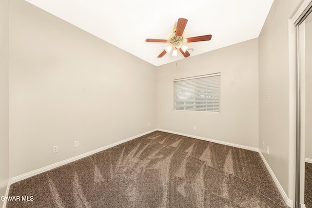 33430 E 133rd St, Pearblossom, CA 93553 - spare room featuring dark colored carpet, a ceiling fan, and vaulted ceiling