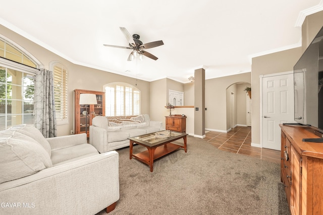 33430 E 133rd St, Pearblossom, CA 93553 - tiled living area featuring arched walkways, ceiling fan, crown molding, and carpet