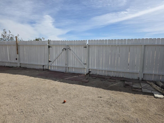 view of gate featuring fence