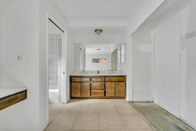 bathroom with tile patterned flooring and vanity