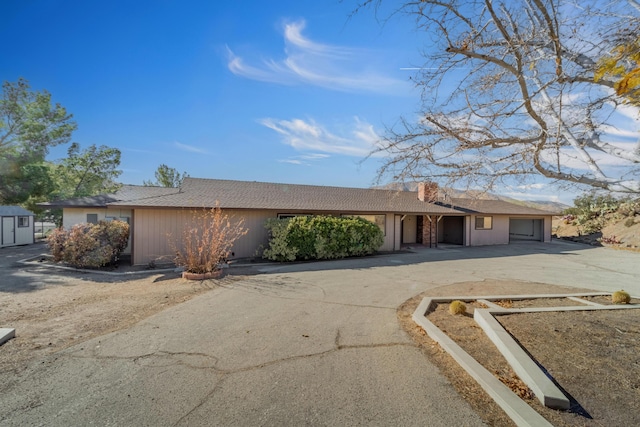 ranch-style home featuring a garage