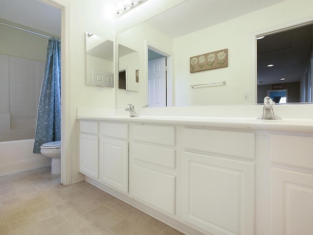 bathroom with toilet, vanity, and shower / bath combo with shower curtain