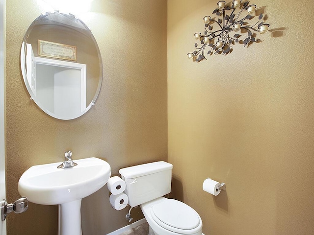 bathroom featuring toilet