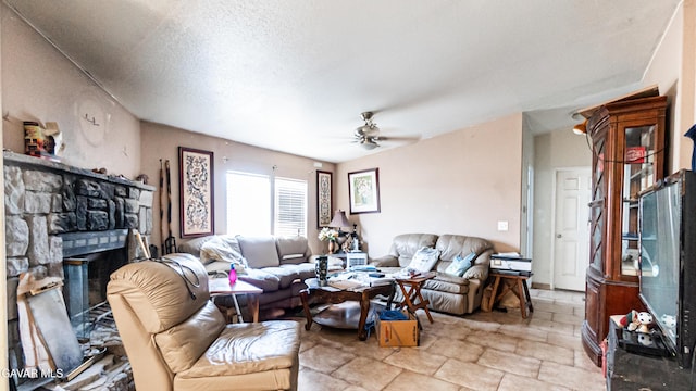 25739 Flatcreek St, Lancaster, CA 93536 - living room featuring a ceiling fan, a stone fireplace, and light stone finish floors