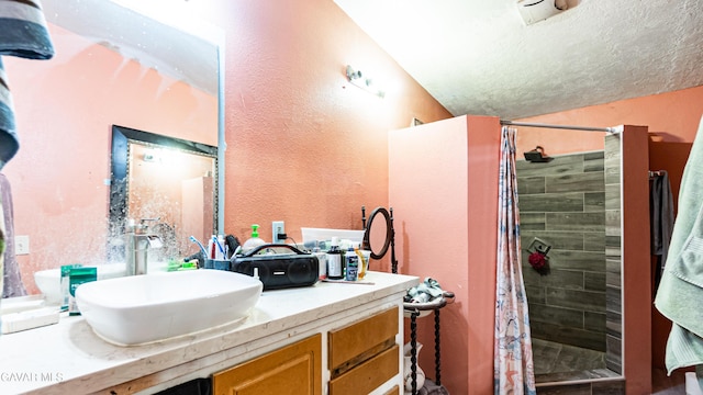 25739 Flatcreek St, Lancaster, CA 93536 - bathroom featuring vanity, a shower stall, and a textured wall