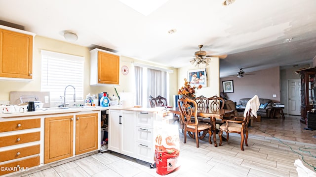 25739 Flatcreek St, Lancaster, CA 93536 - kitchen featuring a sink, a ceiling fan, light countertops, and open floor plan