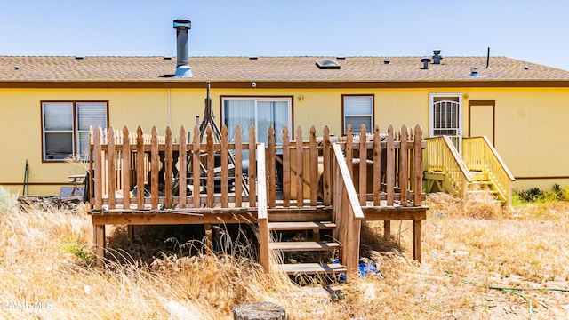25739 Flatcreek St, Lancaster, CA 93536 - rear view of house with a wooden deck