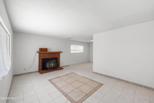 44338 W 23rd St, Lancaster, CA 93536 - unfurnished living room with light tile patterned floors and a textured ceiling
