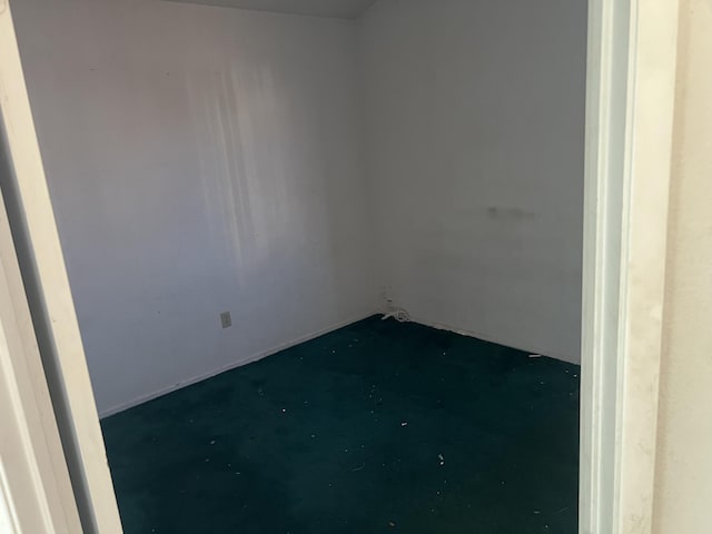 unfurnished room featuring concrete floors