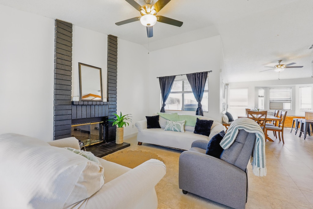 3503 Apollo Ave, Palmdale, CA 93550 - living area featuring a ceiling fan and a brick fireplace
