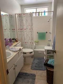 42925 W 15th St Unit 6, Lancaster, CA 93534 - bathroom with shower / bath combo with shower curtain, vanity, toilet, and tile patterned floors