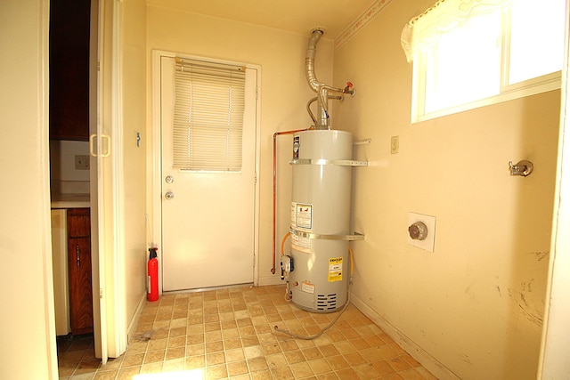 45581 Sancroft Ave, Lancaster, CA 93535 - utility room featuring water heater