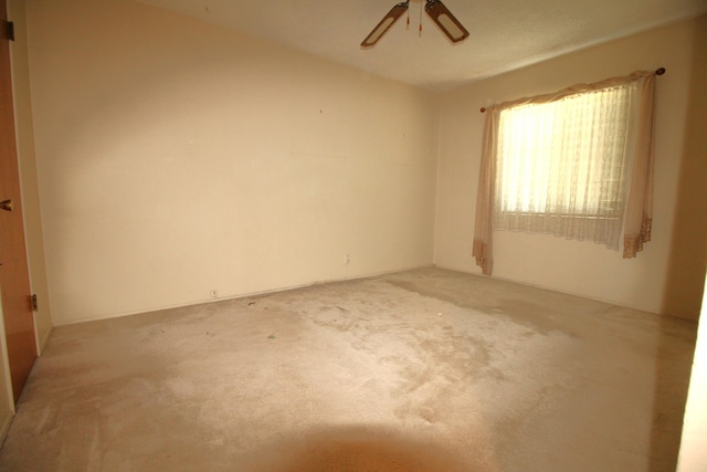 45581 Sancroft Ave, Lancaster, CA 93535 - empty room with light colored carpet and a ceiling fan