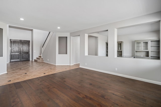 unfurnished living room with tile patterned floors