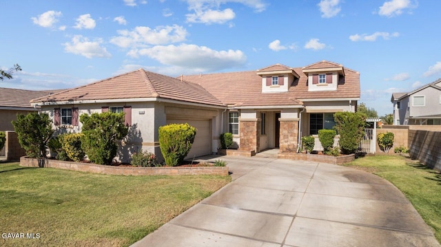 38160 Antibes Dr, Palmdale, CA 93552 - view of front of home with an attached garage, a tile roof, concrete driveway, and stucco siding