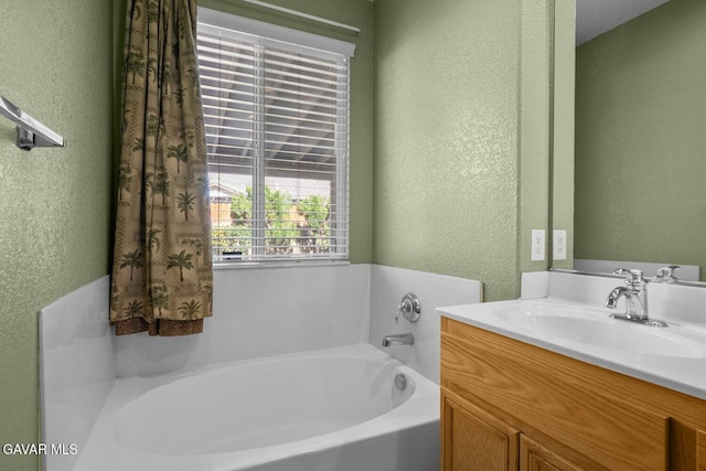 38160 Antibes Dr, Palmdale, CA 93552 - full bath featuring a textured wall, a bath, and vanity