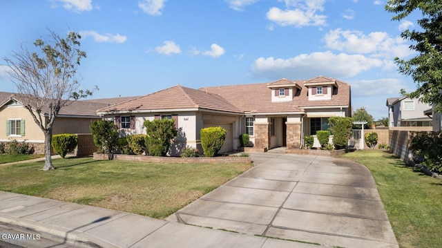 38160 Antibes Dr, Palmdale, CA 93552 - view of front of house with a garage, driveway, stone siding, and stucco siding