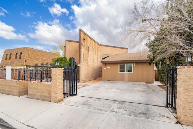 exterior space with fence and a gate